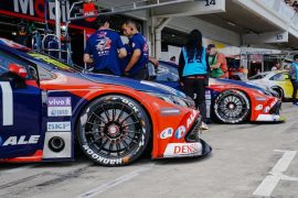 free-photo-of-view-of-cars-parked-in-the-garages-at-a-stock-car-racing-event